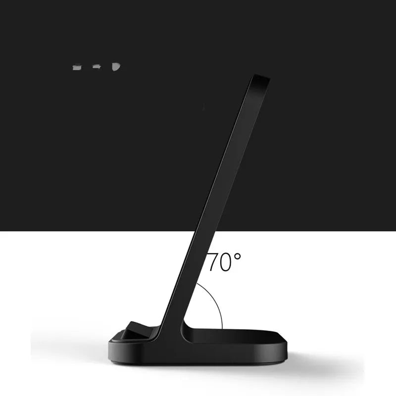 Dark grey vertical wireless charging stand for Apple iPhones on a desk