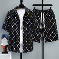 Men's casual sports shorts two-piece set in polyester, showing short sleeve top and matching shorts.