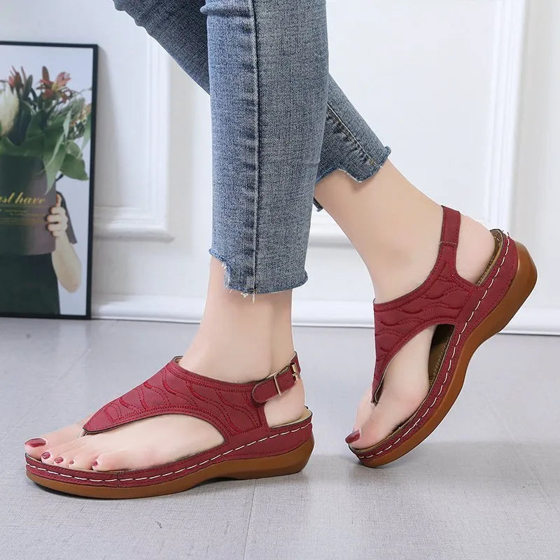 Women's wedge heel casual sandals in red with an adjustable back strap and flip-flop style.