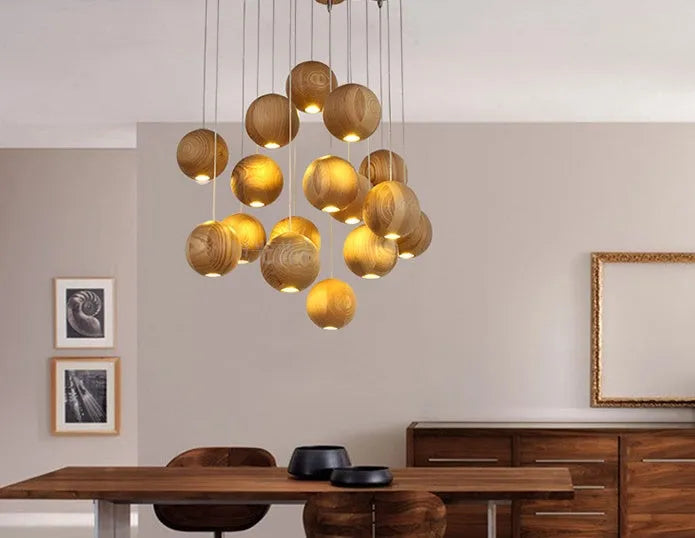 Nordic style wooden ball chandelier with solid wood construction hanging from a ceiling on an adjustable cord.
