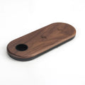 Natural bamboo and wood wireless charging pad on a desk