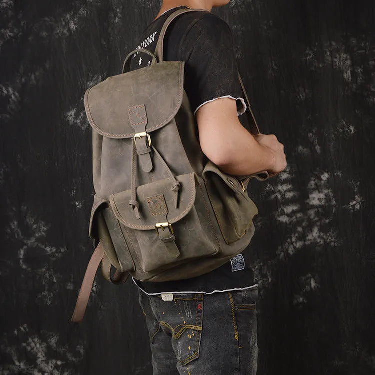 Men's leather drawstring backpack in first layer cowhide, retro style, 30cm x 15cm x 40cm, with curved shoulder strap and soft handle.