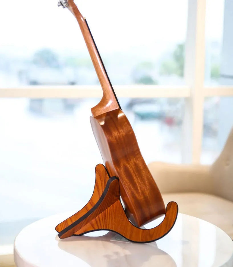 Wooden folding ukulele stand with EVA anti-slip foam holding a ukulele upright