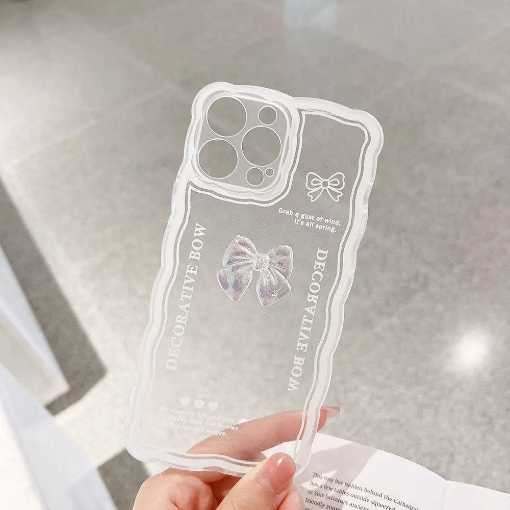 Transparent iPhone case with a 3D ice-through bow on the back and a white love lanyard.