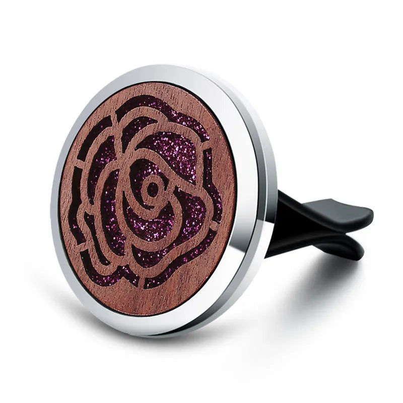 Round car vent aromatherapy clip in alloy wood construction showing hollow centre for incense