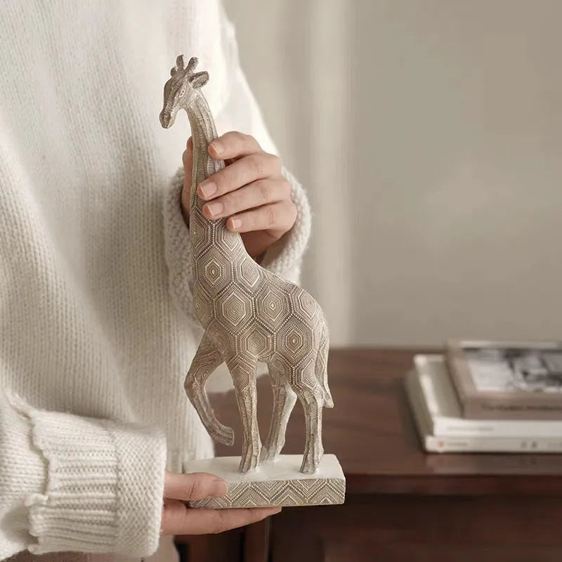 Wood colour synthetic resin giraffe decorative ornament on a shelf.
