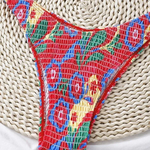 Red floral print women's underwire bikini top and briefs on a mannequin.