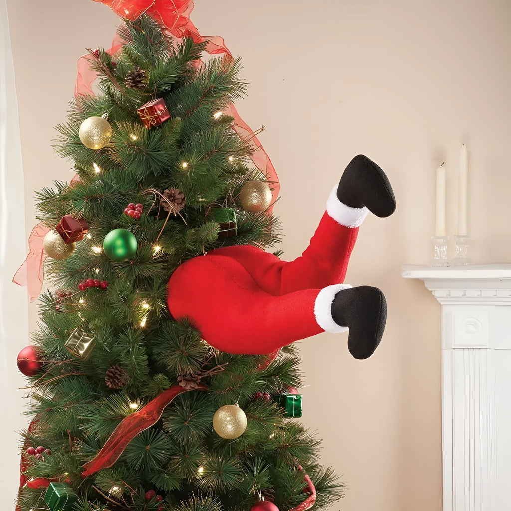 Two white fabric elf legs decorating a Christmas garden display, overall length 38cm