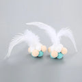 Cat toy feather bouncy ball with colourful pink feathers and blue white feathers for interactive play