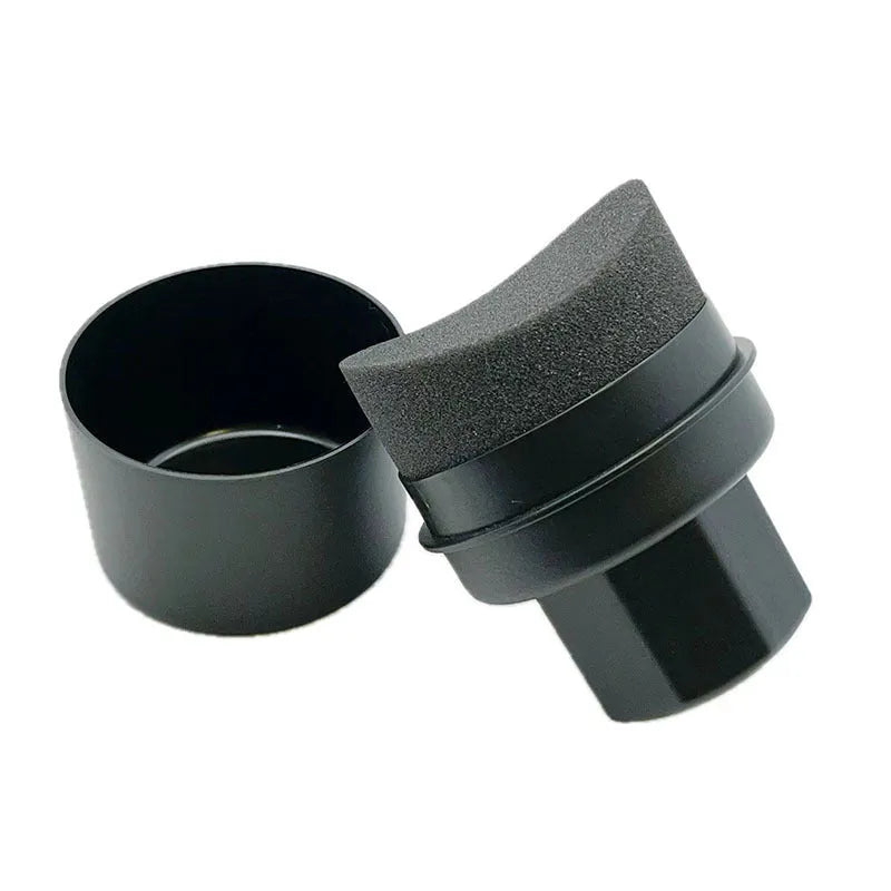 Black car tyre polishing sponge brush with lid on a clean tyre, showing ergonomic PP handle and applicator head.