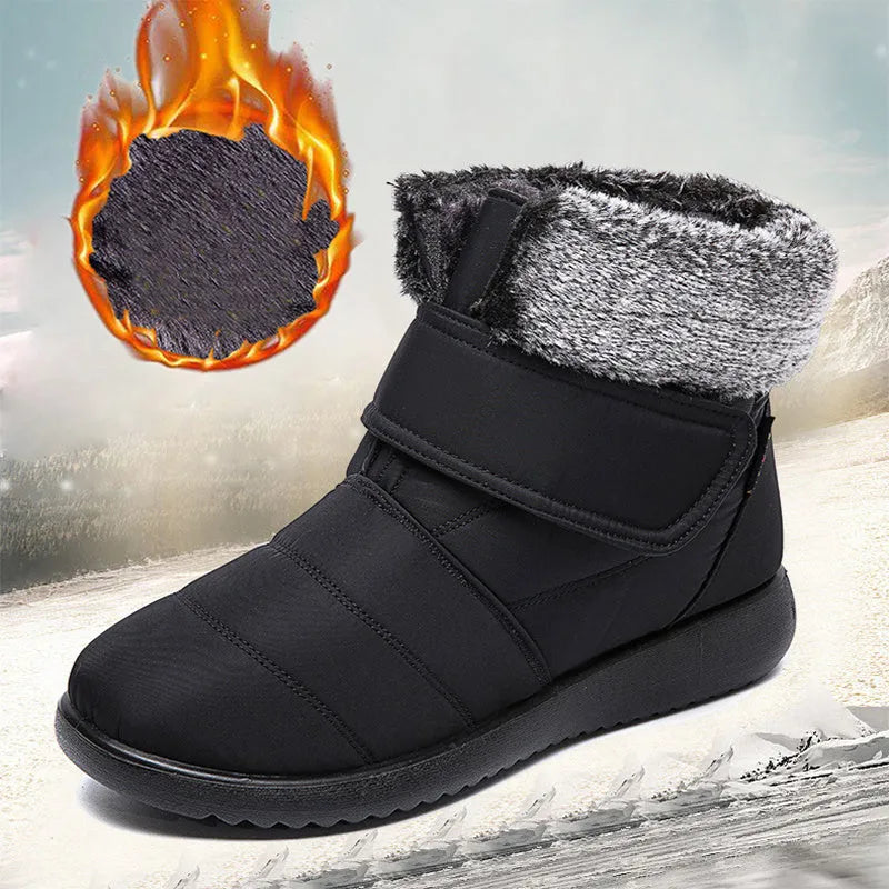 Women's winter snow boots with plush lining, suede upper, velcro strap, flat heel, and anti-skid rubber sole in black.