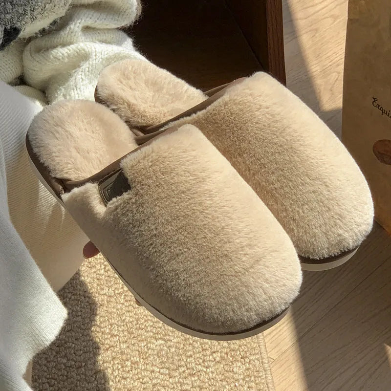 Pair of solid colour plush house slippers with a non-slip PVC sole, shown in coffee brown.