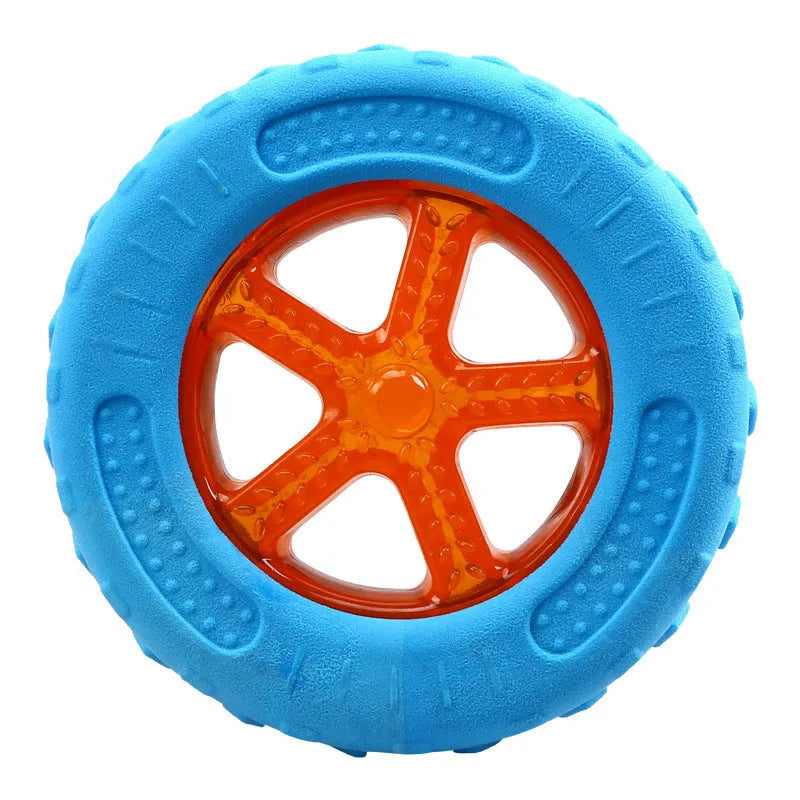 Set of four colourful floating dog toys: a ball, a barbell, and two tyres, on a blue background.