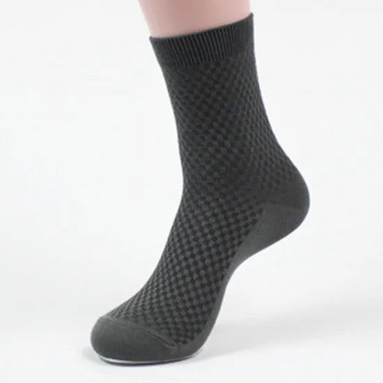 Men's bamboo fibre socks in black, navy, silver, iron grey, and grey blue with small square pattern.