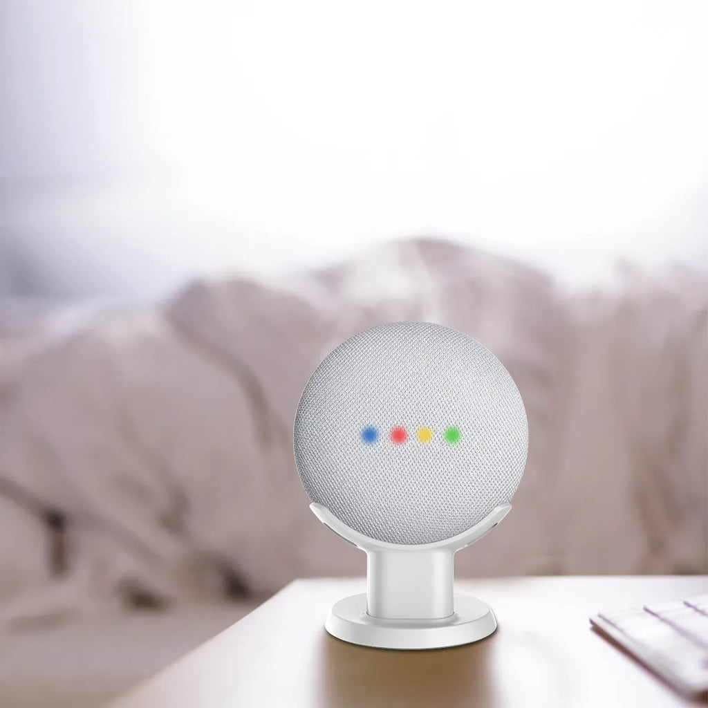 Black PlusAcc Google Home Mini stand holder on a wooden desk.