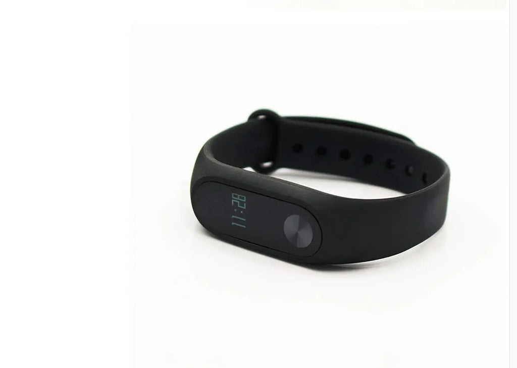 Xiaomi Mi Band 2 black fitness tracker with OLED screen on a wrist.