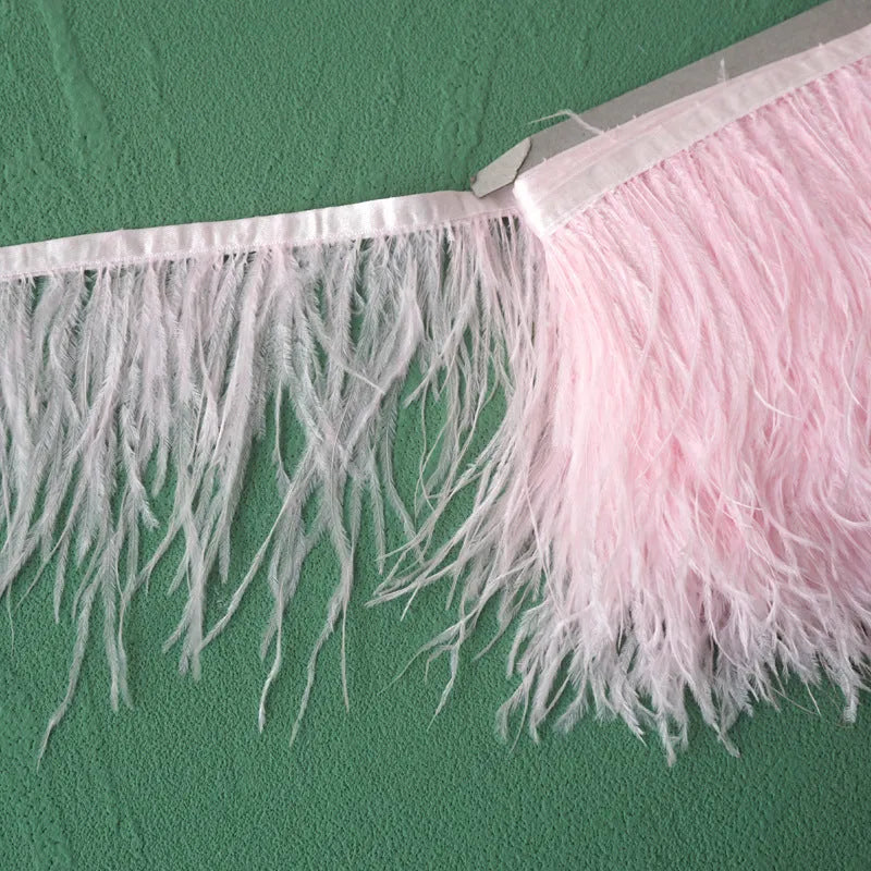Decorative feather cloth strip in multiple colours including white, black, and mint green for DIY clothing and craft projects