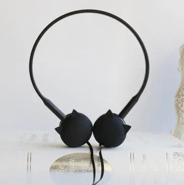 Wireless cat-themed earphones with silicone ear tips in blue colour on a white background