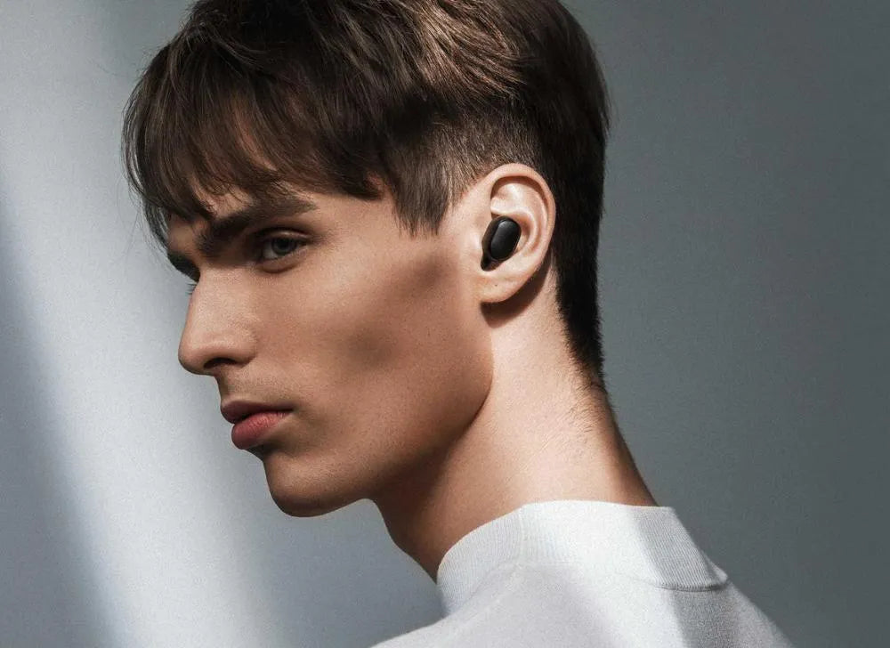 Black Redmi AirDots 2 true wireless earphones with charging case and three sizes of silicone ear tips.