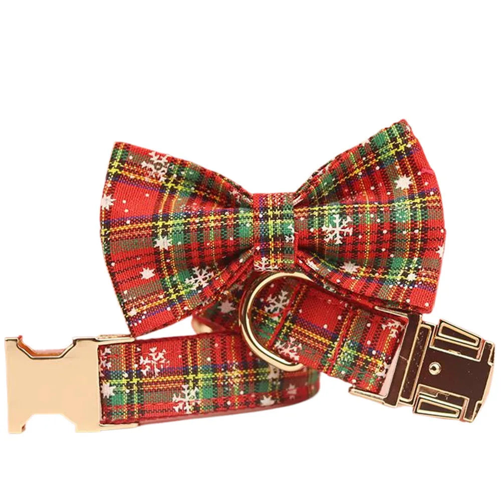 Red snowflake Christmas dog collar and leash set with plaid design and decorative bow on dog vest