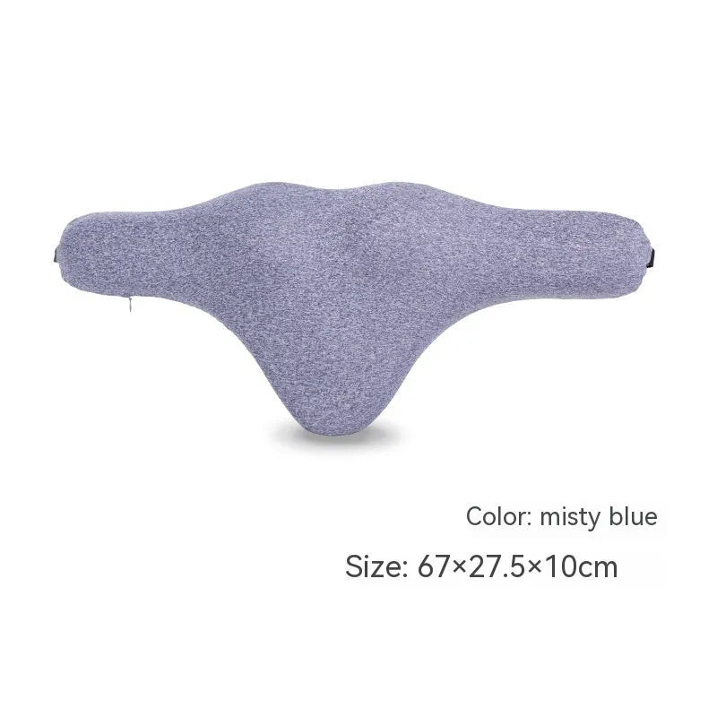 Dark grey memory foam car neck pillow on a car headrest.