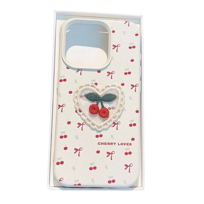 White lychee pattern iPhone case with three-dimensional embroidered cherry detail and anti-fall silicone cover