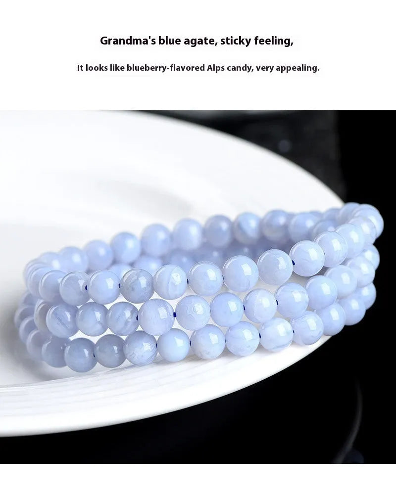 Blue agate beaded bracelet with three strands and a silver Ruyi-style clasp.