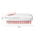 Grey and pink silicone pet bath brush with detachable head for dogs and cats.