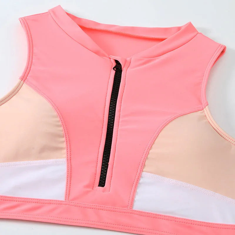 Pink high-waist split bikini swimsuit with briefs style on a mannequin.