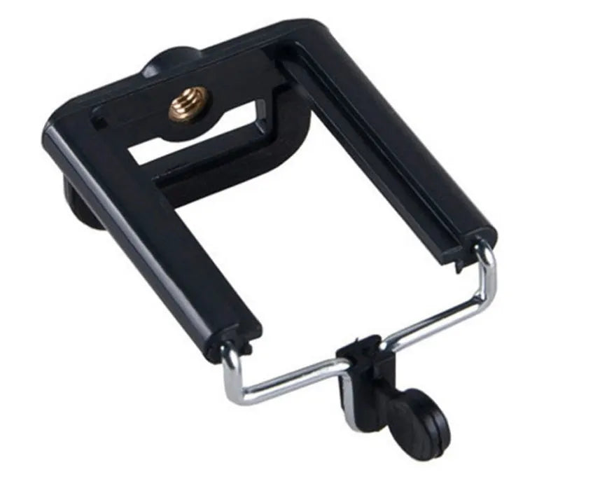 Mini aluminium tripod extended with ball head, shown alongside a U-shaped smartphone clip on a table.