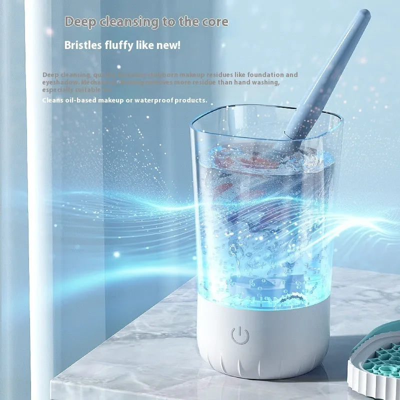 White rechargeable electric makeup brush cleaning unit with USB cable.