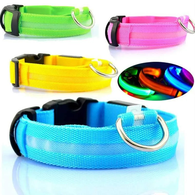 Nylon LED pet collar with adjustable buckle in blue, glowing with fibre optic lights in flash mode on a dark surface