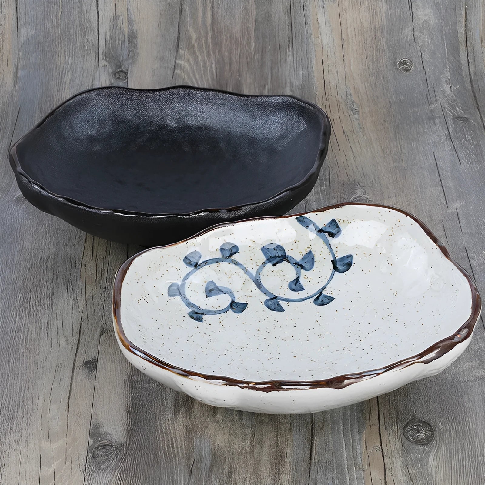 Japanese-style irregular coarse pottery sashimi bowl with floral decoration on glaze