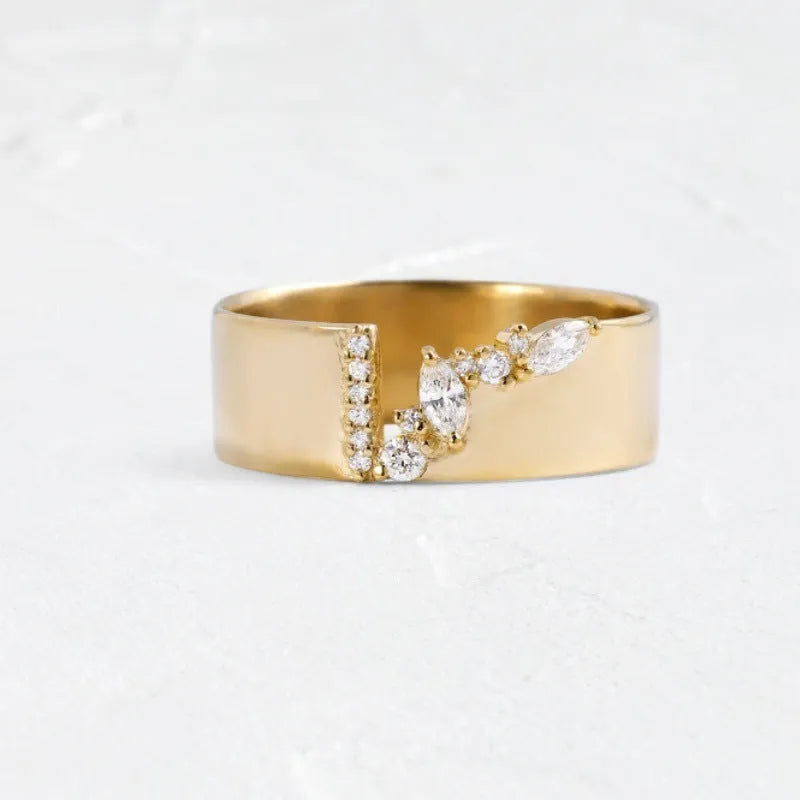 Gold electroplated women's ring with shining zircon stone on a copper band.