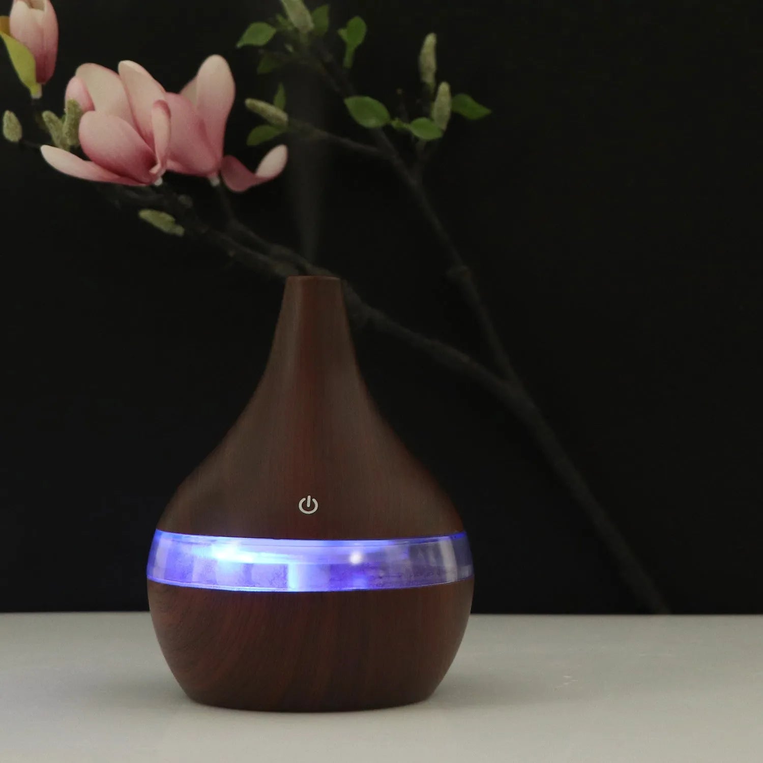 USB mini air purifier humidifier with wood grain finish in columnar shape for small rooms.