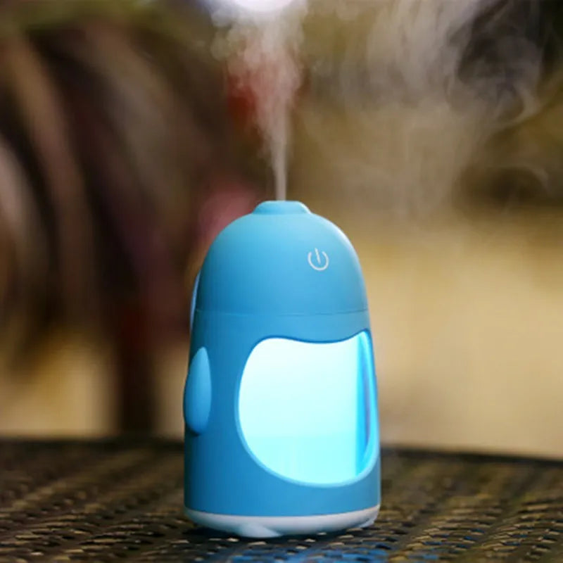 Penguin car humidifier in blue with 400ml transparent tank, USB cable and smiling face switch