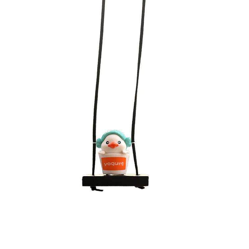 Yellow plastic duck car hanging ornament in cartoon style, shown in four design variants.