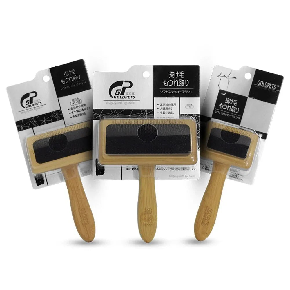 Goldpets bamboo and wood slicker brush for pets with stainless steel pins on a wooden handle.