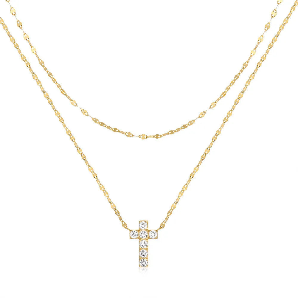 Close-up of a sterling silver double layer twin diamond cross pendant necklace on an adjustable chain.