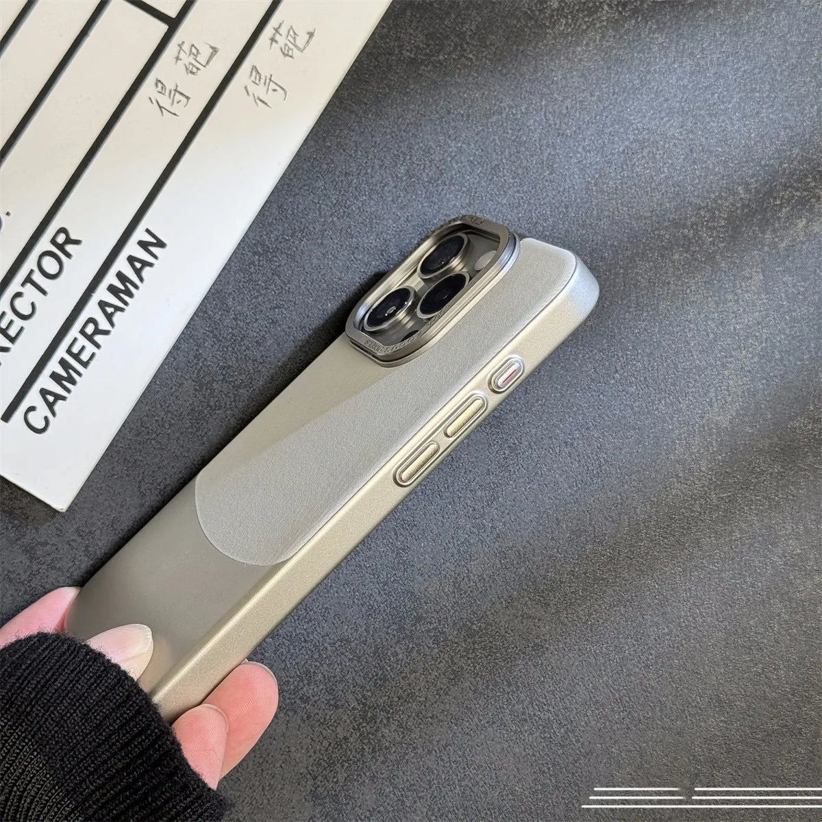 Electroplated PC phone case for iPhone 15 Pro Max in colour-matched finish with flannel fabric texture