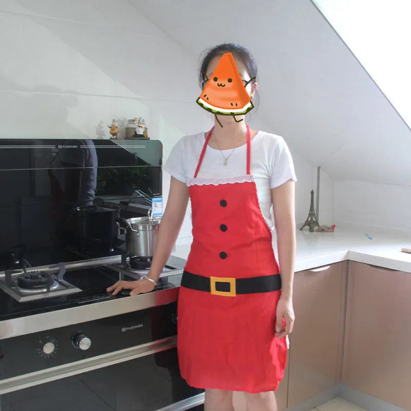 Red polyester Christmas apron shown in adult and children's sizes for festive kitchen use.