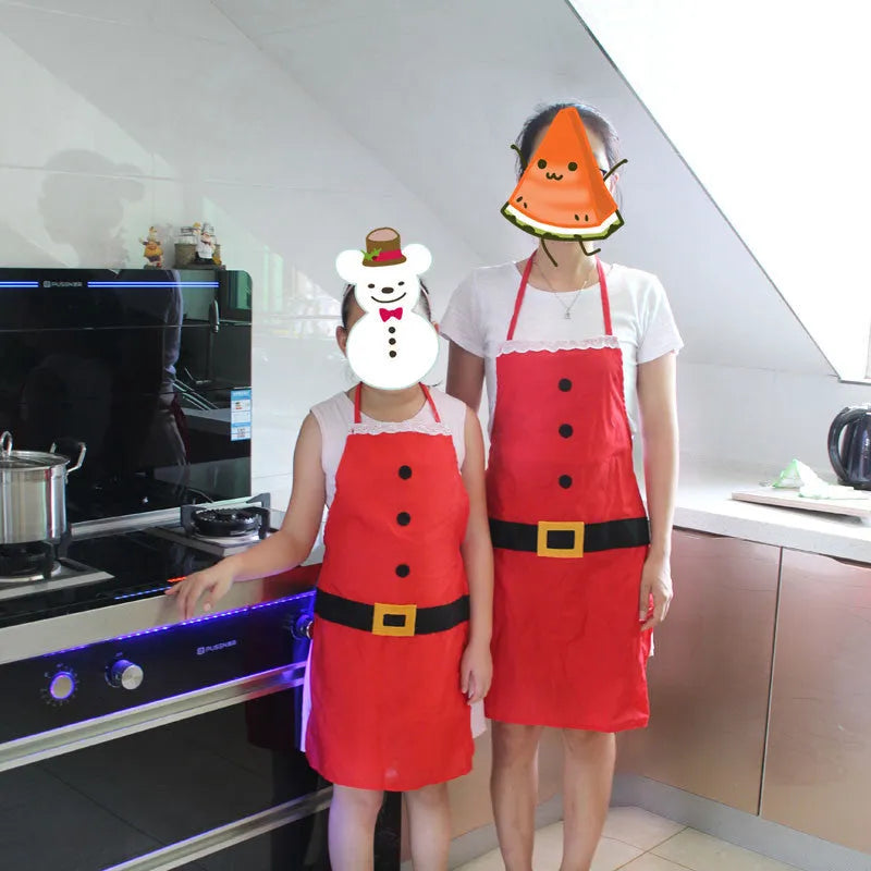 Red polyester Christmas apron shown in adult and children's sizes for festive kitchen use.
