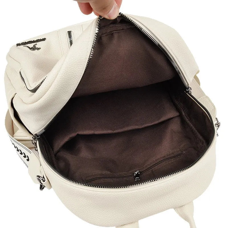 Geometric patchwork genuine leather backpack with belt decoration in beige available for travel