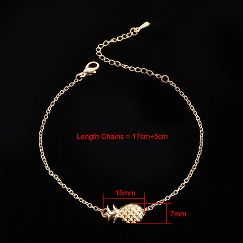 Gold and silver alloy bracelet with a pineapple charm on an adjustable band.