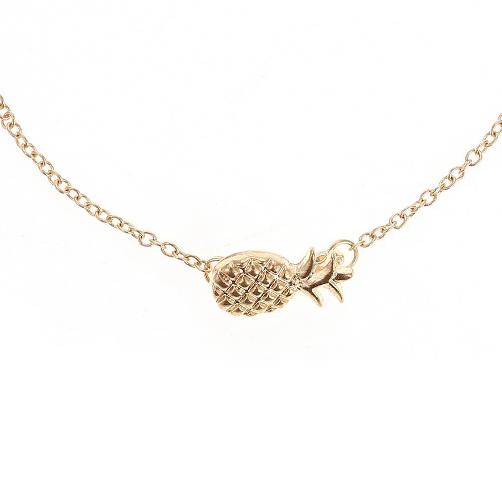 Gold and silver alloy bracelet with a pineapple charm on an adjustable band.