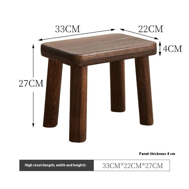 Distressed solid wood stool for changing shoes with a bracket frame structure.