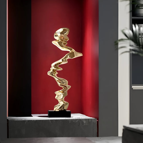 Ran Ran Rose abstract resin sculpture in bright gold, silver, or blue on a neutral background.