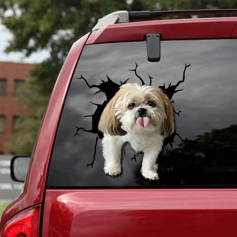 Tearing-style dog silhouette reflective window sticker on a glass surface, showing three available sizes.