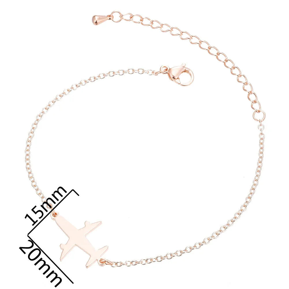 Alloy bracelet with simple airplane pendant in gold colour, unisex style