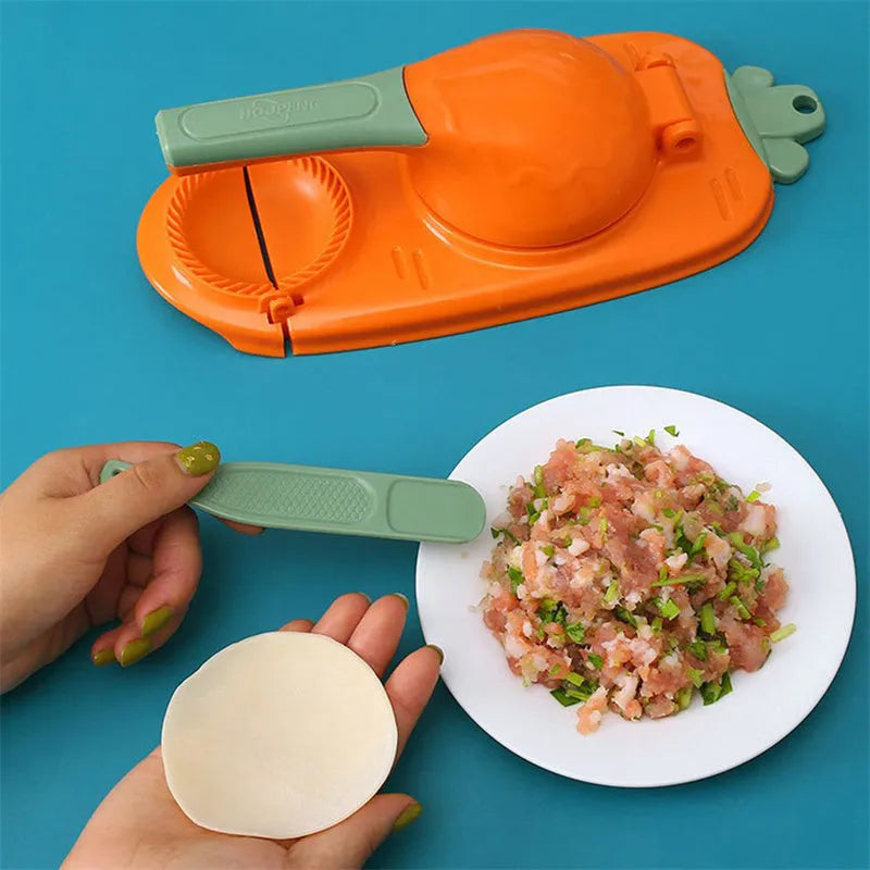 Orange and white plastic manual dumpling maker tool with press and mould.